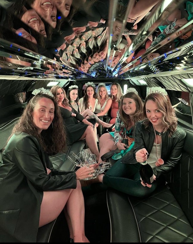 A group of friends sitting inside of a limousine