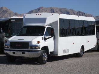 White 24 passenger shuttle bus