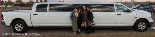 Family photo in front of white Dodge Ram Limousine