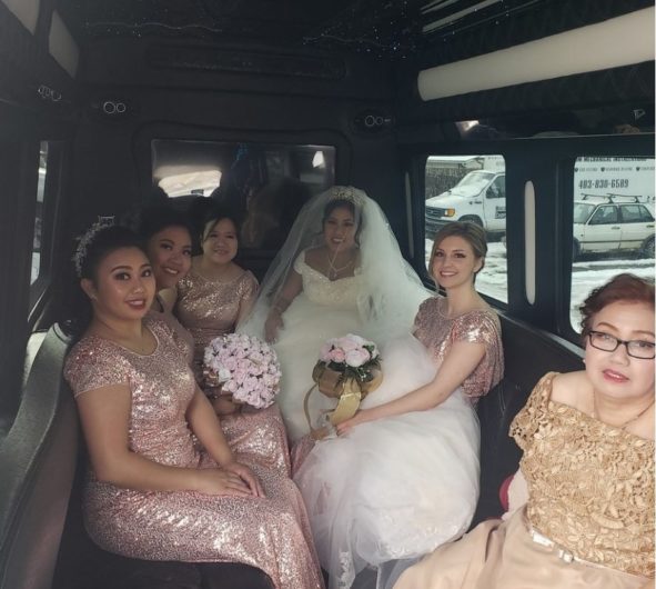 Bridal party photo inside of party bus
