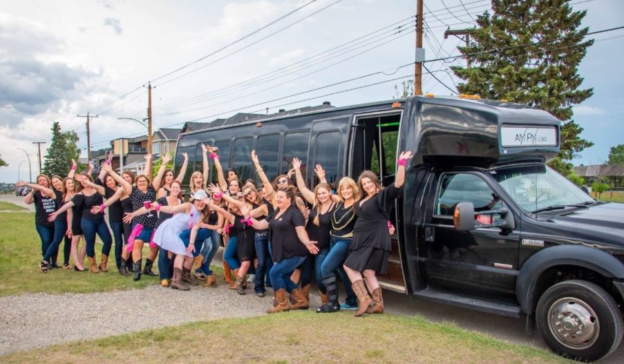 Stagette party in celebrating in front of Party Bus
