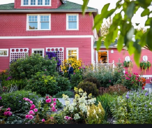 The Deane House with flowers outside in summer