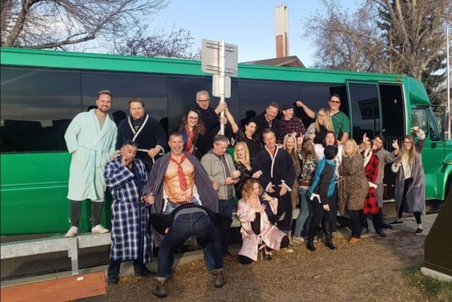Pajama Party celebration in front of green Party Bus