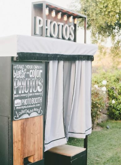 Wedding Photo booth outside in green grass