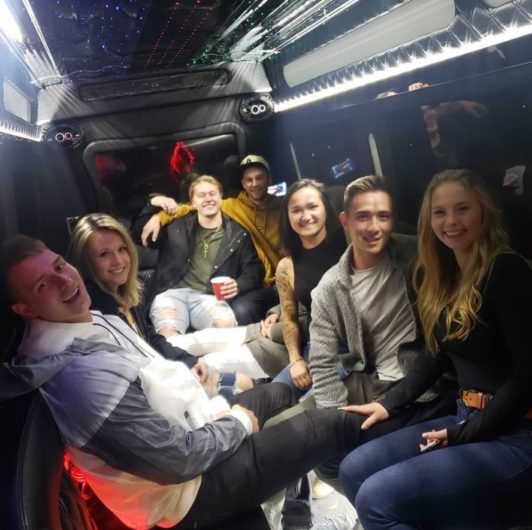 Group photo inside of a party bus