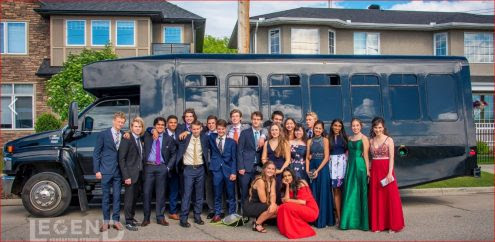 Group Grad Photo in front of Black Party Bus