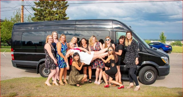 Stagette celebration photo in front of black Mercedes Mini Party Bus
